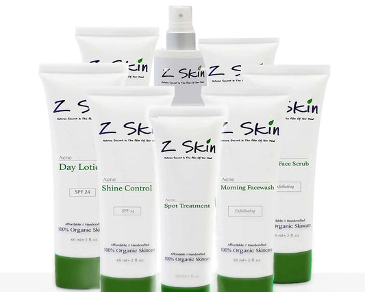 Complete Acne System with organic treatments to clear skin, including day lotion, night lotion, exfoliating washes, shine control, spot treatment, face scrub, and toner.