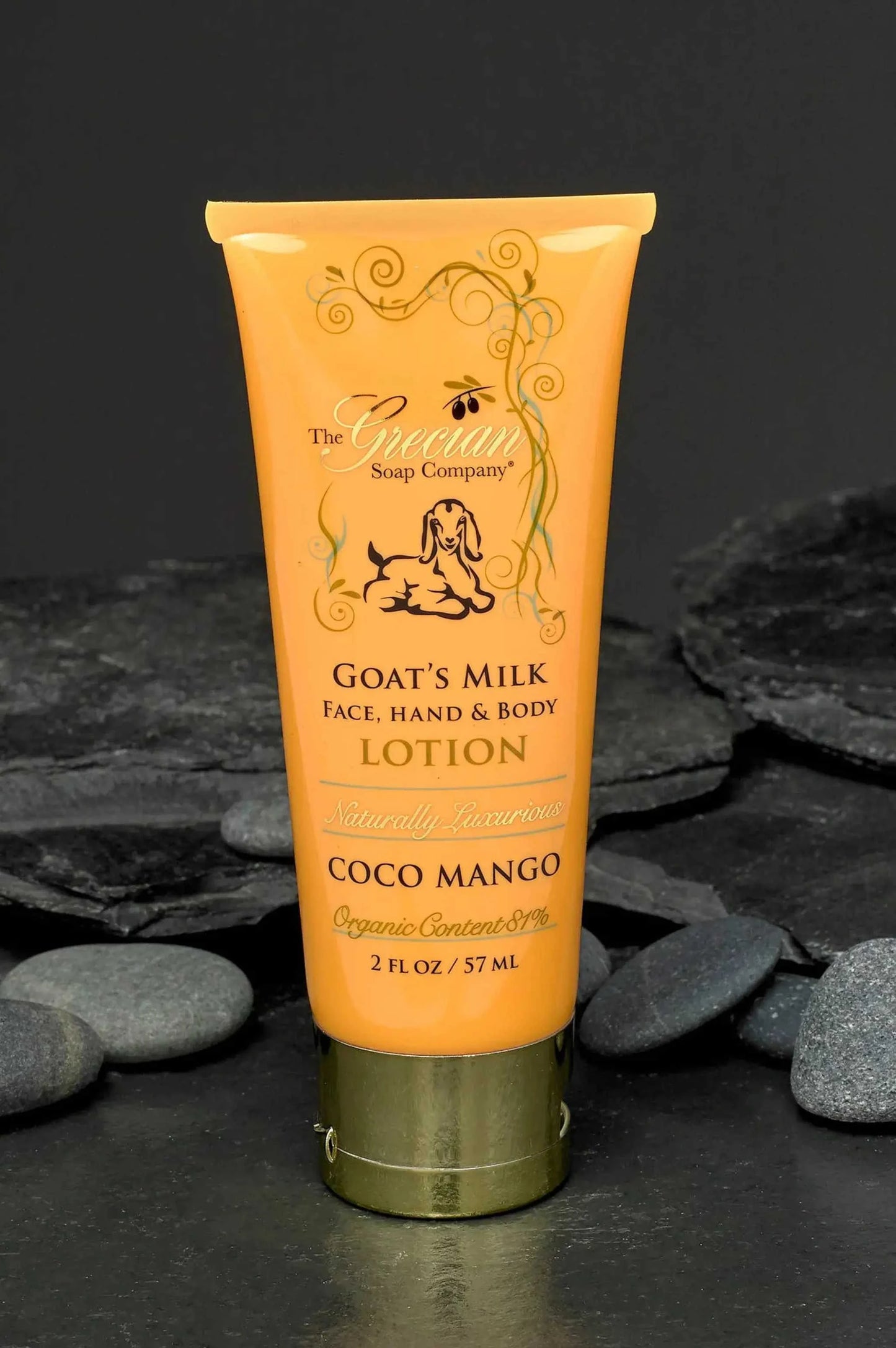Organic goat's milk lotion in 2oz tube with 'Coco Mango' fragrance, ideal for travel.