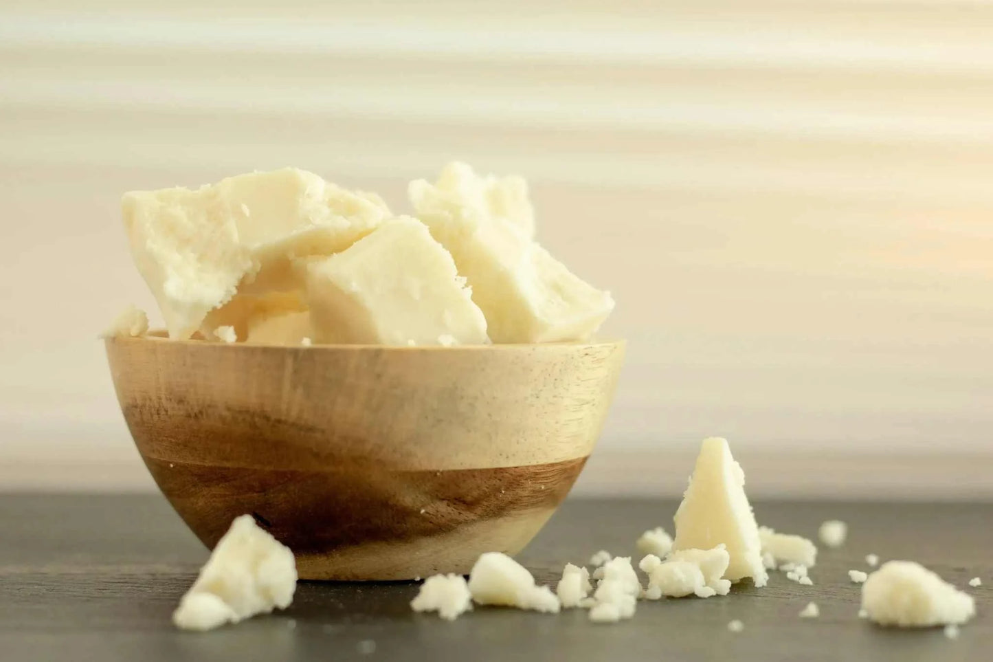 Kokum butter in wooden bowl for skincare and haircare, 10 lbs bulk.