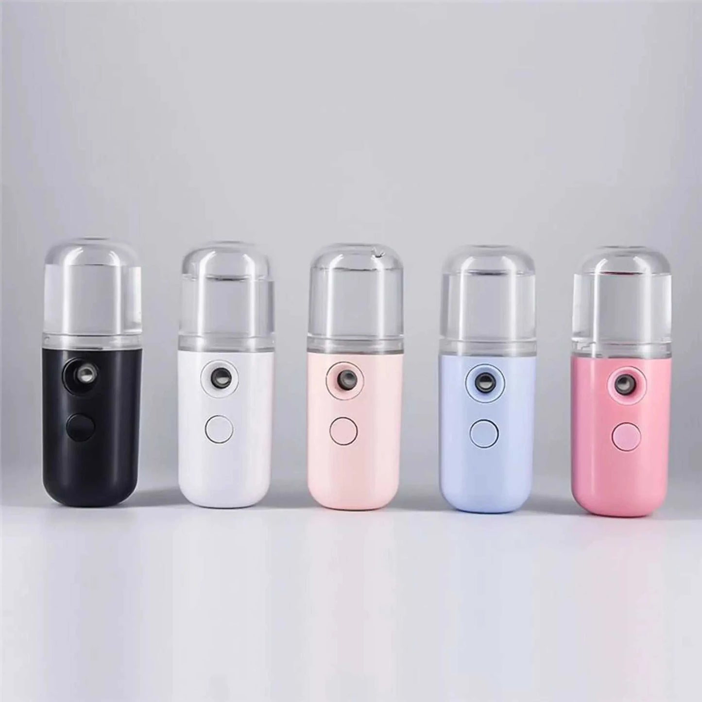 Compact Nano Mist Sprayer in assorted colors with fine mist nozzle and rechargeable design.