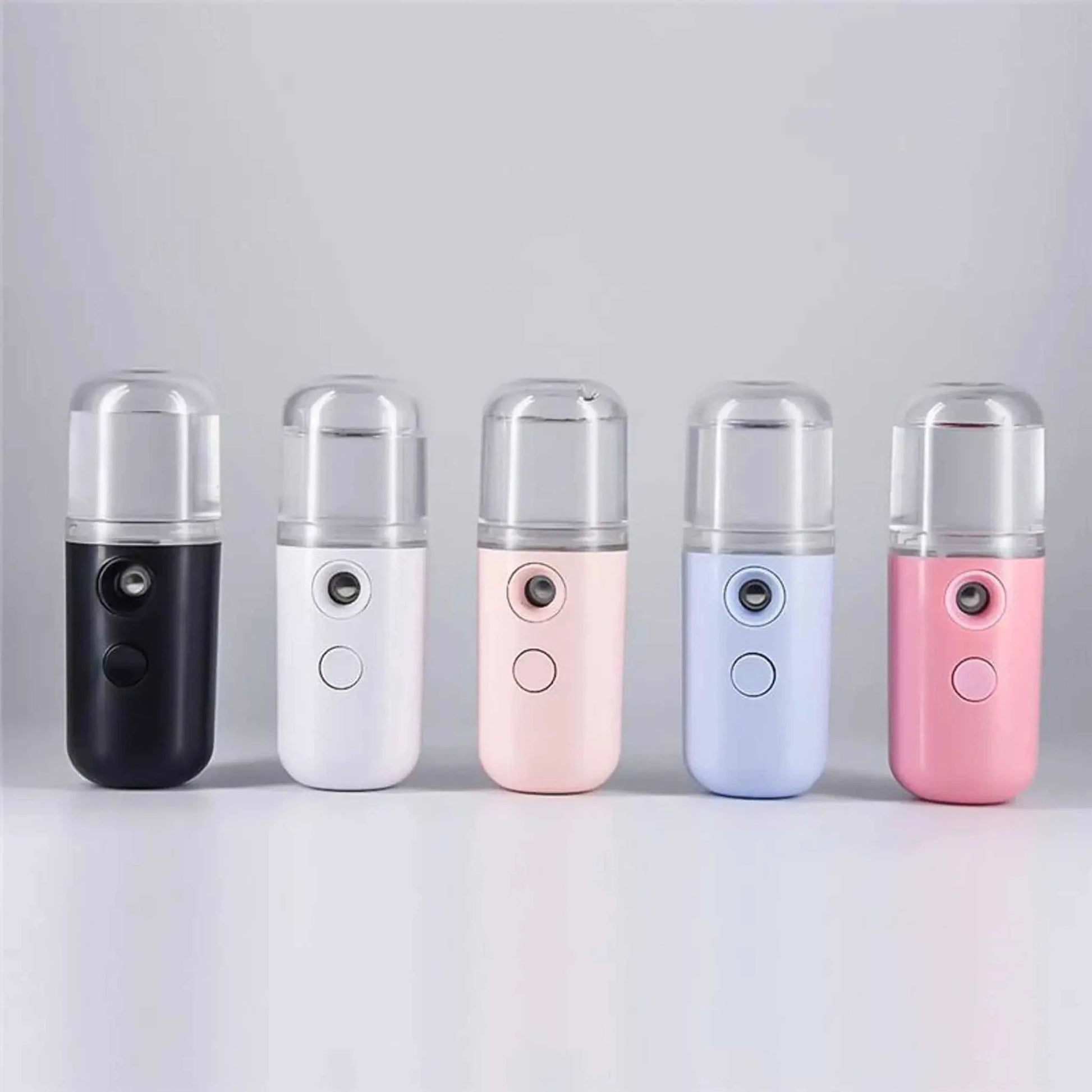 Compact Nano Mist Sprayer in assorted colors with fine mist nozzle and rechargeable design.