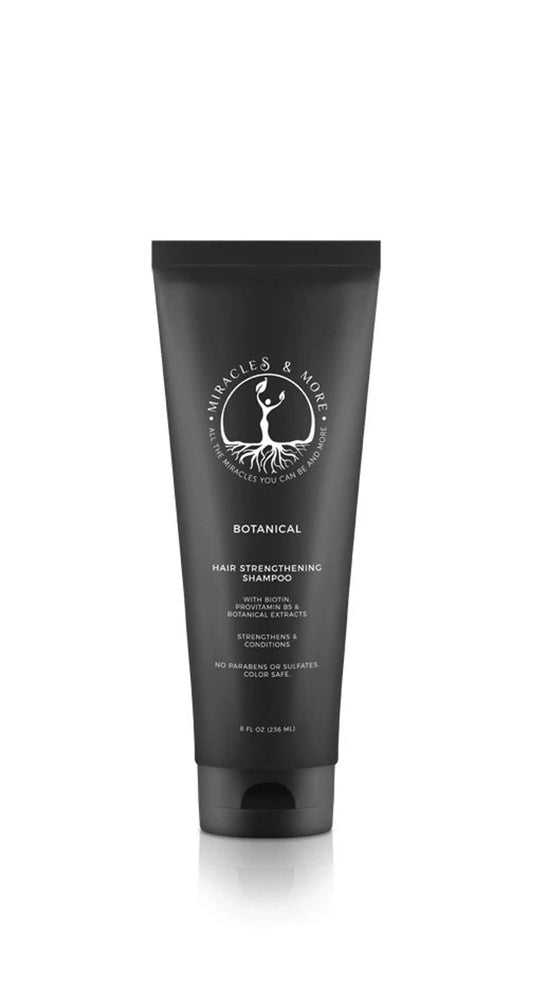 Botanical hair strengthening shampoo bottle with biotin and ProVitamin B5 for nourishing fragile hair.