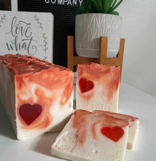 Cleansing soap bar with earthy floral aroma, featuring heart design and soothing rosemary and lavender.